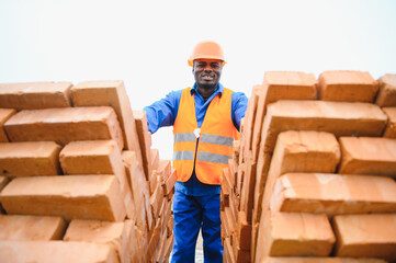 African american Construction worker in uniform and safety equipment have job on building....