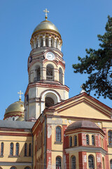 Bell tower with clock on the territory of the ancient monastery of Simon the Kananite. New Athos, Abkhazia