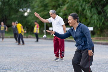 asian senior woman petanque practice on playing field,elderly athlete,sport,workout,health,competition
