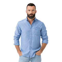 Fototapeta premium Confident Man in Casual Blue Shirt Posing with Neutral Expression and Stylish Beard on White Background