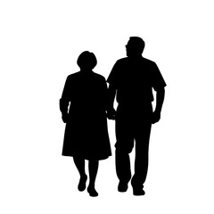 Elderly couple walking together in silhouette, enduring love