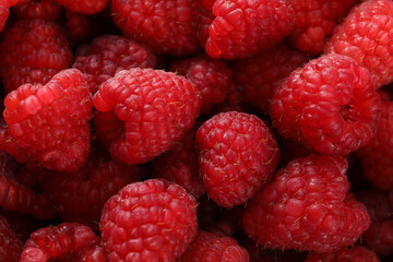 fresh raspberries on background, close up