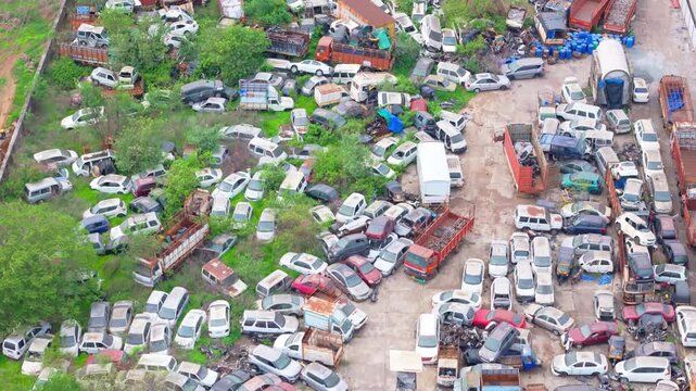 Aerial view show packed yard with discarded machines