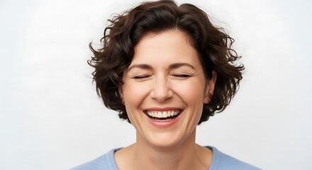 Joyful Woman with Short Curly Hair Laughing with Eyes Closed