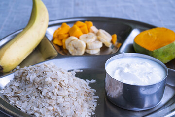 Yogurt and Rice Flakes with Mango, Banana  Dahi Chiura, National Paddy Day Special Dish in Nepal