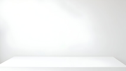 Minimalist white studio backdrop with empty table