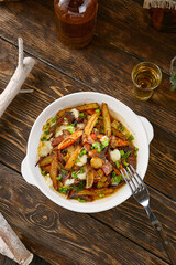 Fried potatoes with onions, rustic bright lighting, overhead composition