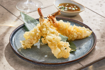 Tempura shrimp on blue ceramic plate, bright natural lighting, overhead composition, modern asian...