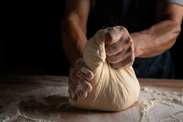 Artisan Baker Kneading Dough A Close-Up of Hands Shaping Bread