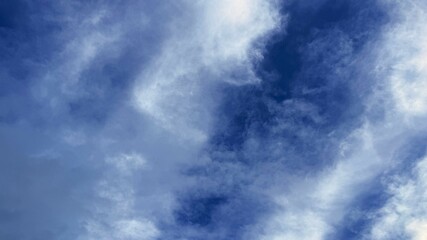 Dramatic Sky with White Clouds Against Deep Blue Backdrop, Natural Beauty