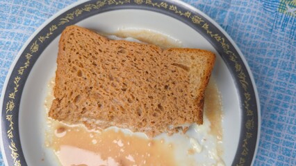 Viral Dubai chai toast trending on internet, freshly made with bread filled with malai milk cream, soaked in hot spiced tea. A nostalgic and viral comfort food