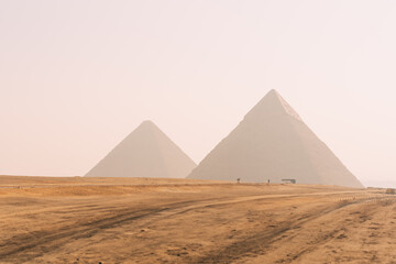 Giza pyramids complex rising from the desert in egypt