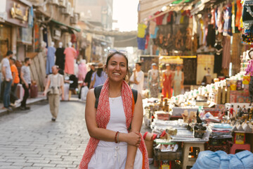 Tourist smiling in a traditional market in cairo, egypt