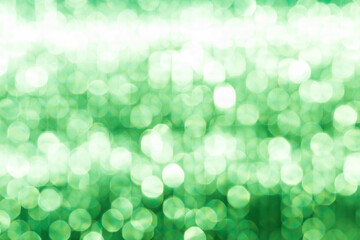 Abstract blurred green light bokeh background, festive season concept background, green bokeh pattern background