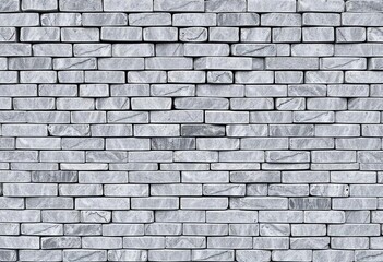Obraz premium Seamless texture of gray, white, and anthracite bricks and stone tiles, surface, elegant