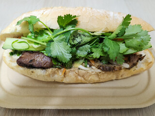A close-up photo of a Bahn Mi sandwich.