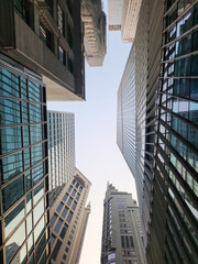 A photo of a cluster of buildings taken from a low angle.