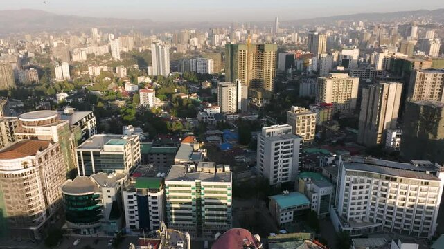 Sprawling District Of Bole With High-rise Buildings And Hazy Mountains In Background. Addis Ababa, Ethiopia At Sunrise. wide aerial shot