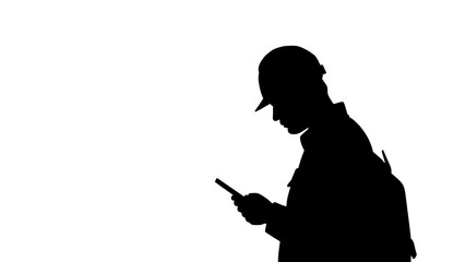 Construction Worker in Silhouette: A construction worker, silhouetted against the brightness, meticulously checks their smartphone, embodying the modern intersection of labor and technology.