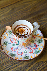 High Angle View Of Coffee Cup On Wooden Table In Vintage Cafe. 