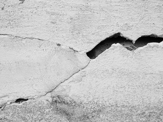 Crack wall texture background broken earthquake effect, whtie grey building cement damage pattern...