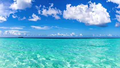 Panoramic view of crystal clear turquoise ocean beneath a serene sky