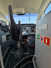 Cockpit of a hydrofoil ship with a sign that says do not enter on it. There is a red and white sign...