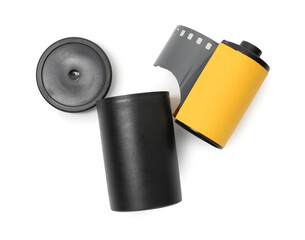 Roll of photographic film and canister isolated on white, top view