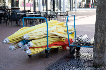 set of umbrellas on a trolley for restaurant terrace bar outdoor