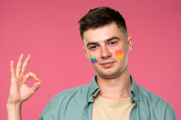 Expressive Portrait of Young Person with Rainbow Colors on Cheeks