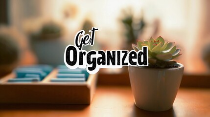 Encouraging text "Get Organized" overlaying a soft-focus office space, used for promoting time management and workflow tips.