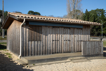 weathered wooden building closed facade schutter wood planks door