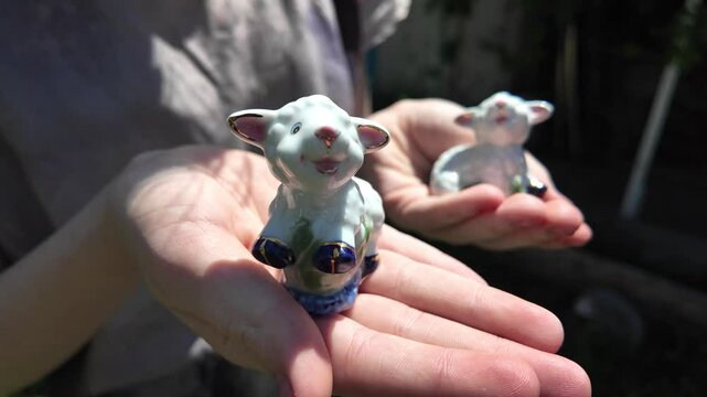 toy lamb. ram figurine. faience lamb figurine. glass toy. vintage figurine. Cute Easter lamb or sheep decoration in young spring grass and ivy,