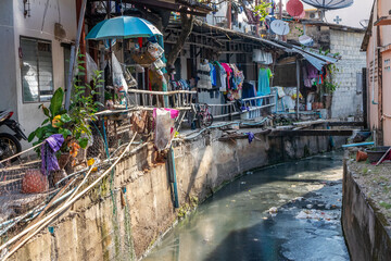 Homes alongside a polluted canal, Phuket Town, Thailand