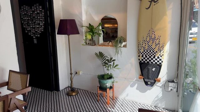 Inside indoor cafe coffee shop surf board tropical vibes hipster trendy thailand