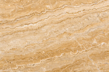 Fototapeta premium Old brown stone wall with a rough, grunge texture perfect for vintage backgrounds and antique designs