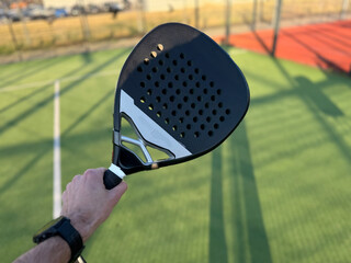 paddle tennis racket hitting ball. close- up on the racket