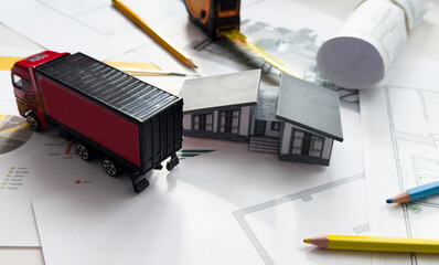 building house on blueprints with worker construction project