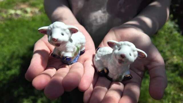 toy lamb. ram figurine. faience lamb figurine. glass toy. vintage figurine. Cute Easter lamb or sheep decoration in young spring grass and ivy,
