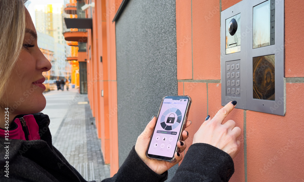 Poster woman locking smartlock on the entrance door using a smart phone. concept of using smart electronic 
