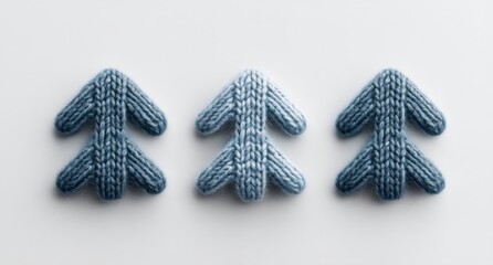 A clean white backdrop serves as the setting for three blue arrows of different sizes pointing upwards, symbolizing progression and movement towards a goal