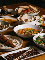 Different dishes on a restaurant set table for dinner