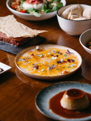 Different dishes on a restaurant set table for dinner