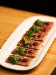 Beef slices in a plate on the table