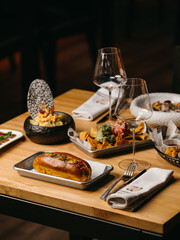 A set table with many dishes and wine