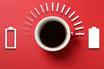 Cup of coffee and energy gauge on red background, top view. Low level battery becoming fully...
