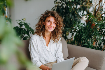 Businesswoman at home working with casual wear and her laptop