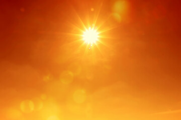 Bright sun in orange sky during hot summer weather. Extremely high temperature