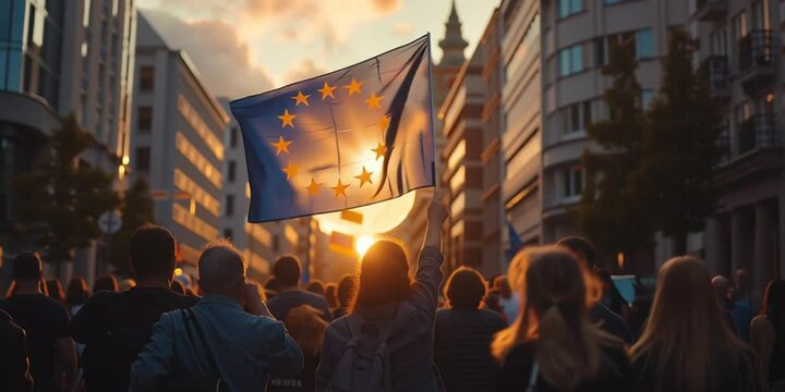 Demonstranten mit europ&auml;ischer Flagge ziehen durch die Stadt