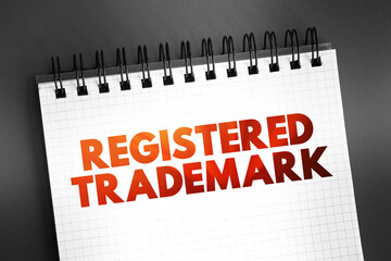 Registered trademark text on notepad, business concept background
